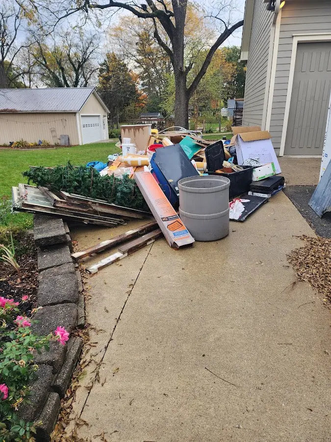 Dumpster being loaded with debris for Commercial Dumpster Rental in Argo